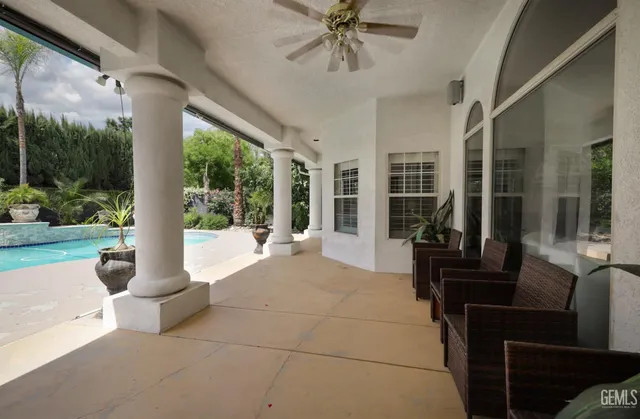 a view of a swimming pool with a patio