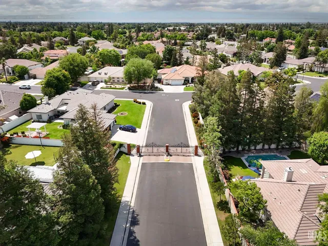 an aerial view of a house with yard swimming pool and outdoor seating