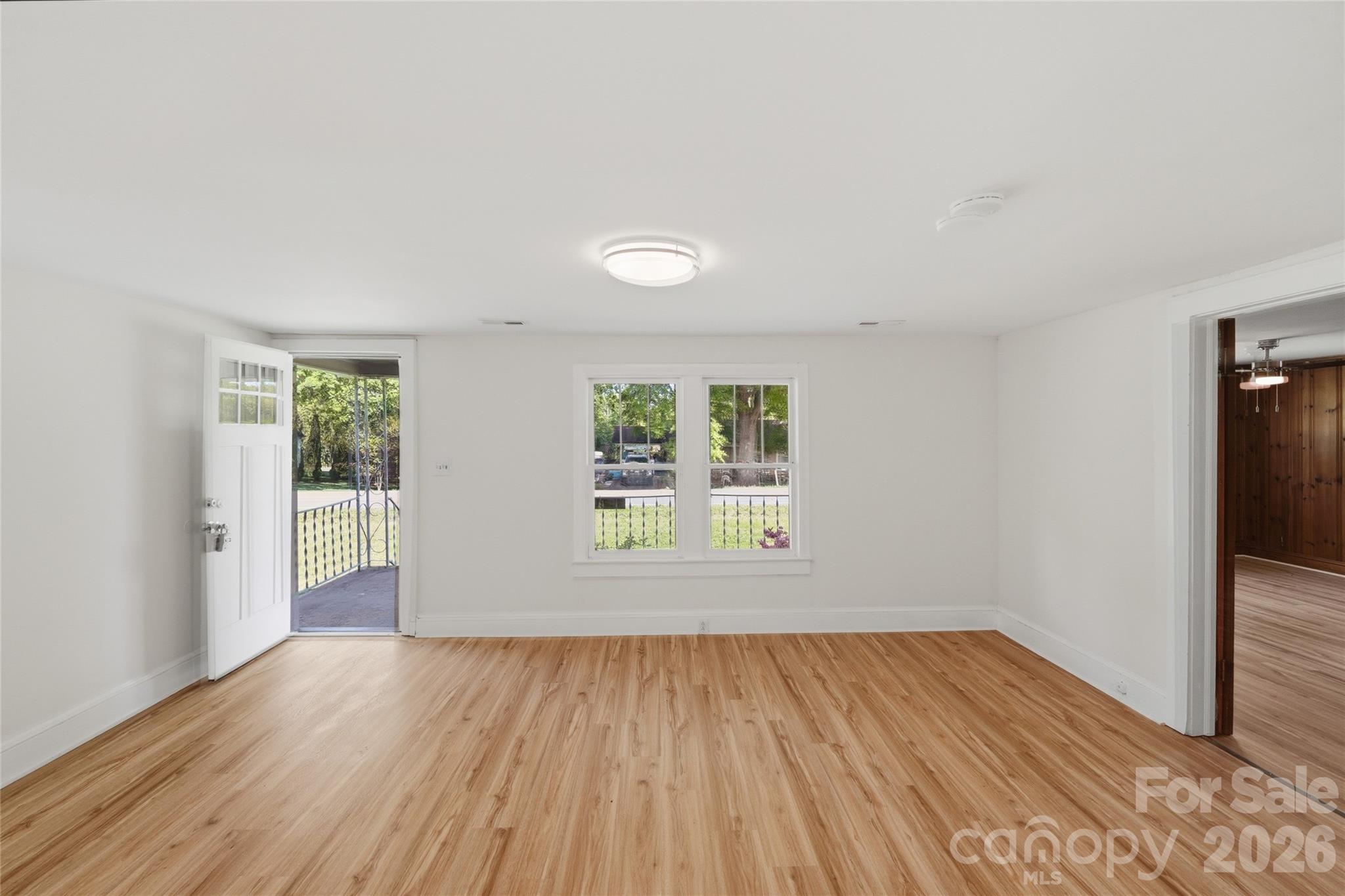 2231 Claremont Road Newton, NC 28658 - Photo 29 of 39 an empty room with wooden floor and windows