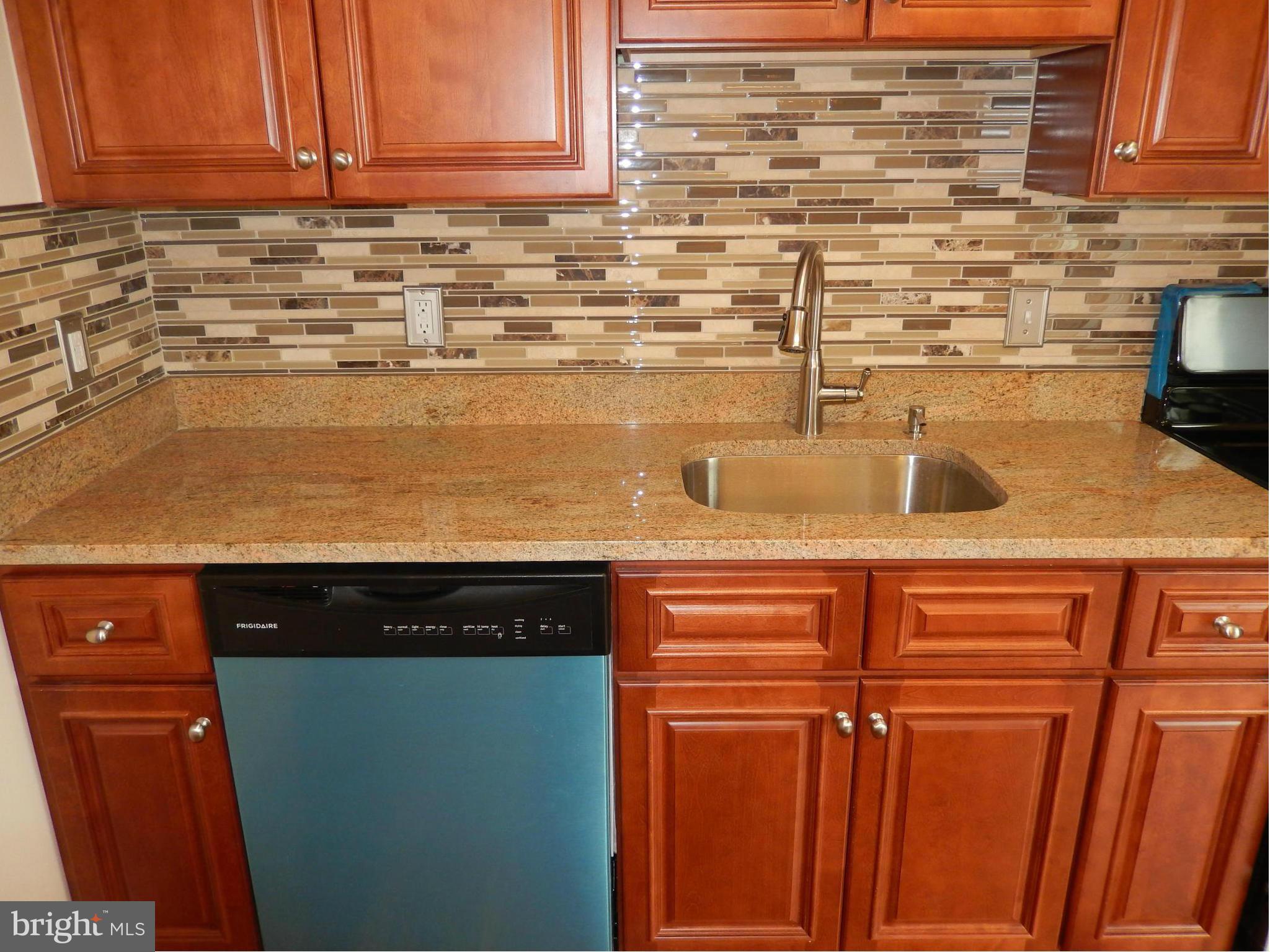 622 Charraway Road Baltimore, MD 21229 - Photo 13 of 28 a close view of sink and cabinets