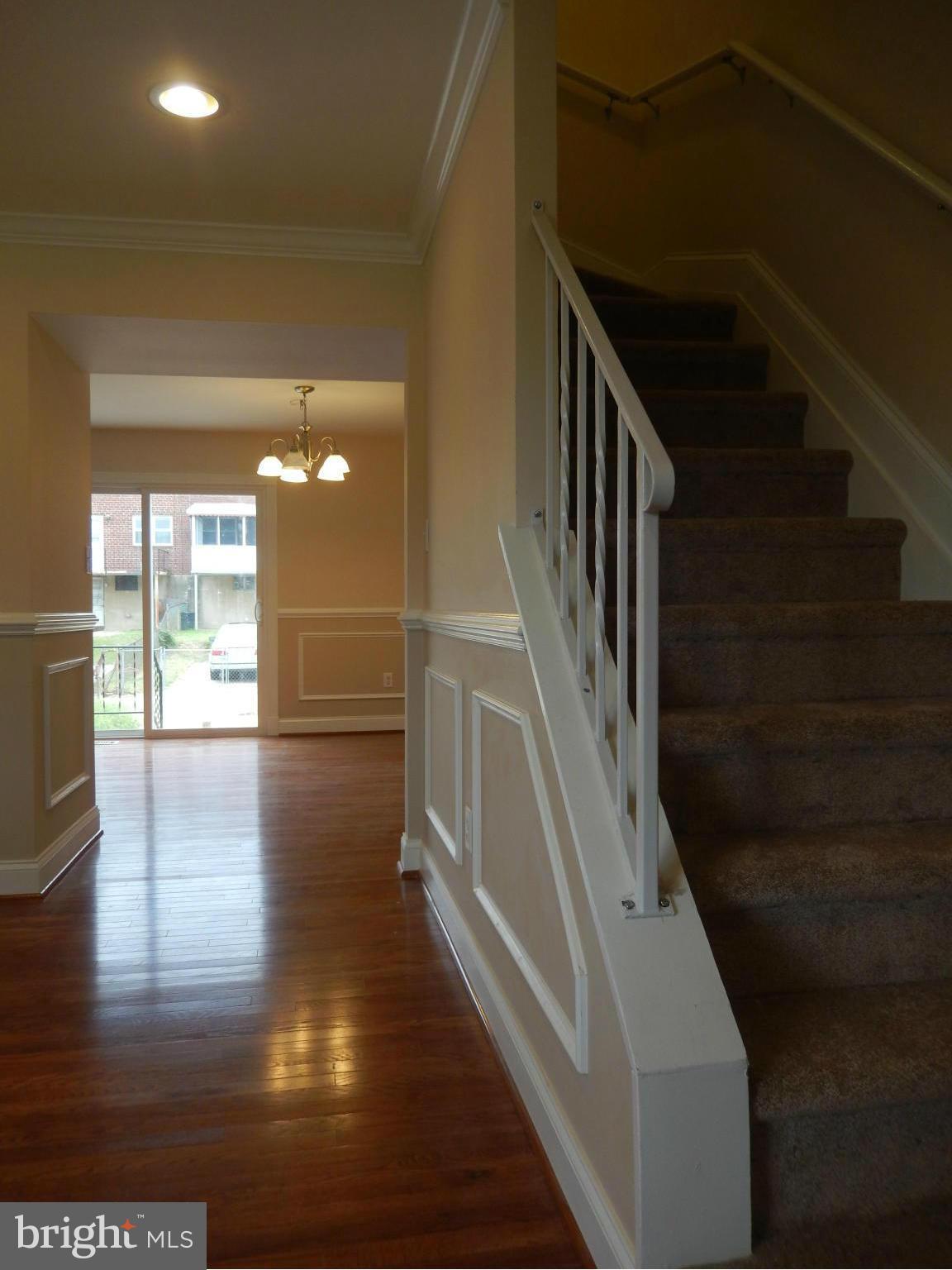 622 Charraway Road Baltimore, MD 21229 - Photo 16 of 28 a view of entryway and hall with wooden floor