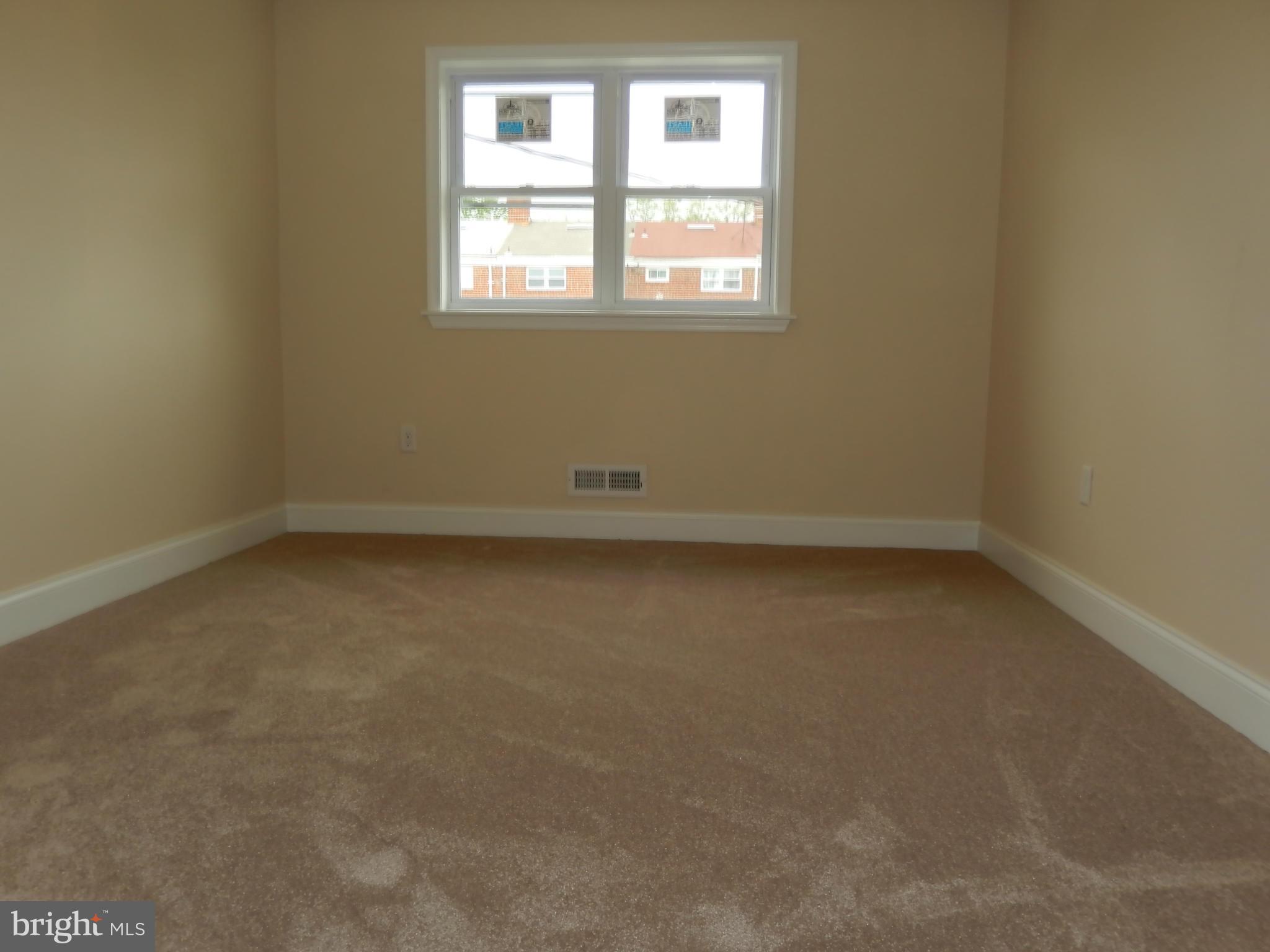 622 Charraway Road Baltimore, MD 21229 - Photo 18 of 28 an empty room with a window