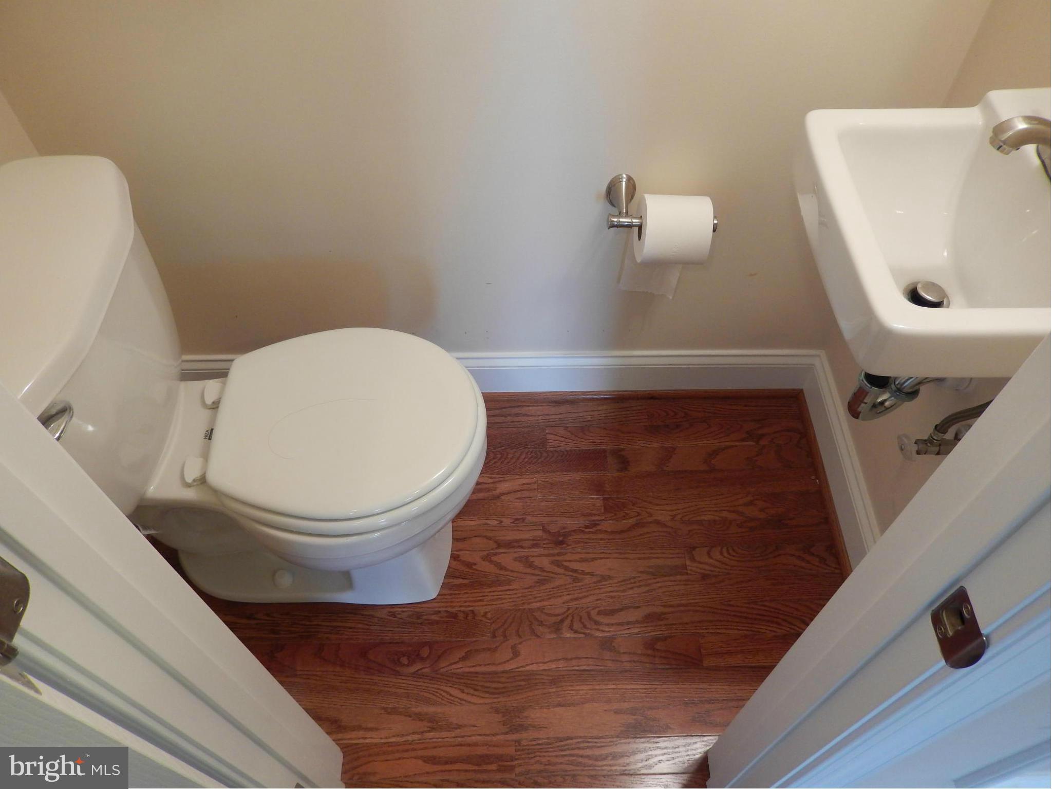 622 Charraway Road Baltimore, MD 21229 - Photo 6 of 28 a bathroom with a toilet and a sink