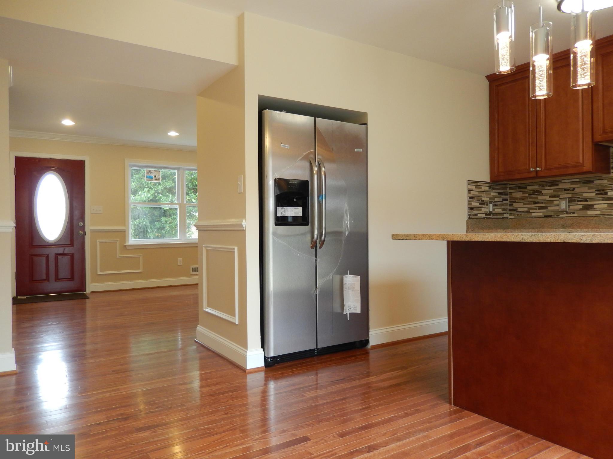 622 Charraway Road Baltimore, MD 21229 - Photo 7 of 28 a view of a kitchen cabinets and wooden floor
