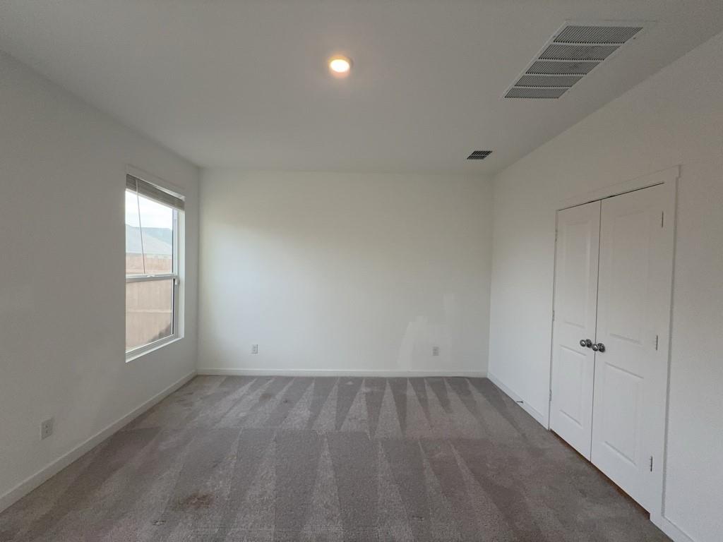 537 Ml Trce Way Princeton, TX 75407 - Photo 13 of 40 an empty room with wooden floor and windows