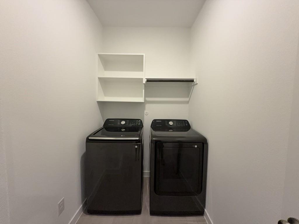 537 Ml Trce Way Princeton, TX 75407 - Photo 21 of 40 a view of storage and utility room with washer and dryer