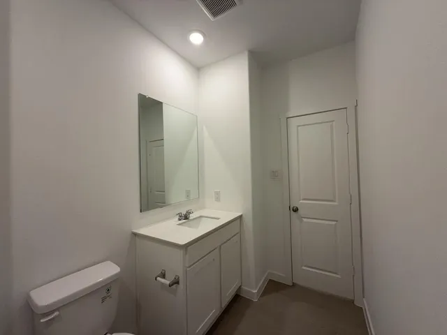 a bathroom with a sink and toilet