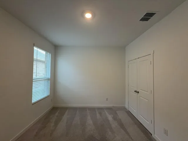 an empty room with white walls