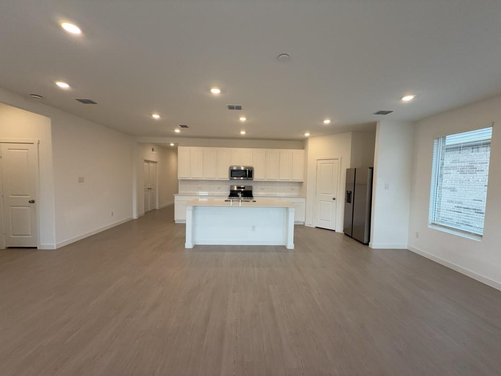 537 Ml Trce Way Princeton, TX 75407 - Photo 9 of 40 a view of a kitchen with a sink and a refrigerator