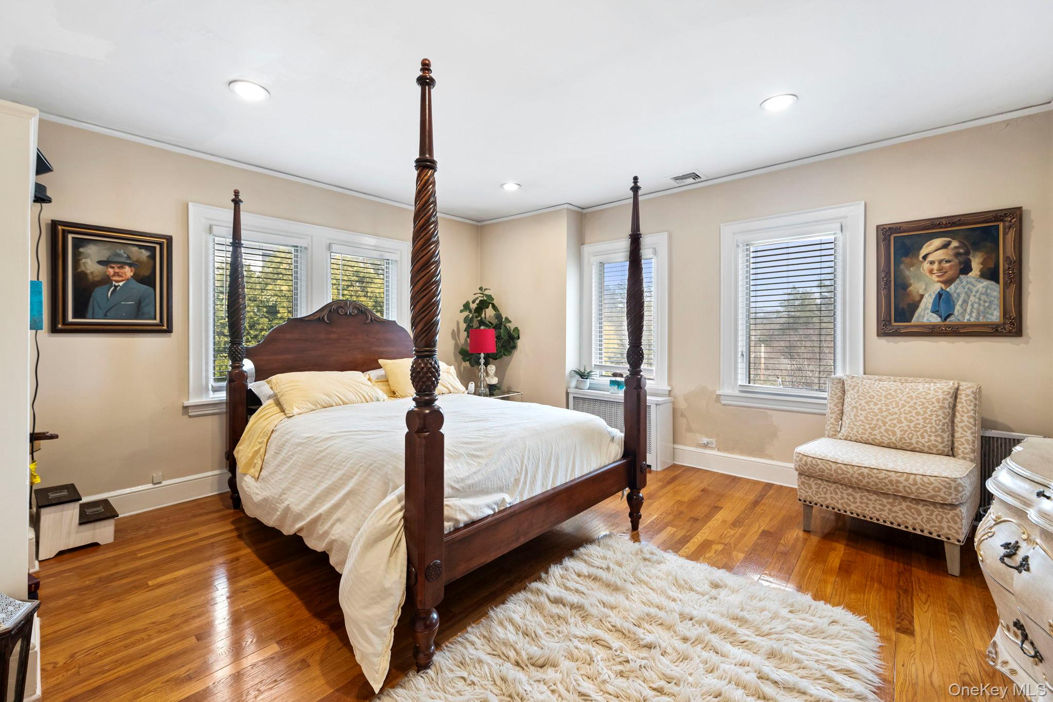 44 Fenimore Road New Rochelle, NY 10804 - Photo 23 of 46 a bedroom with a large bed couch and a window