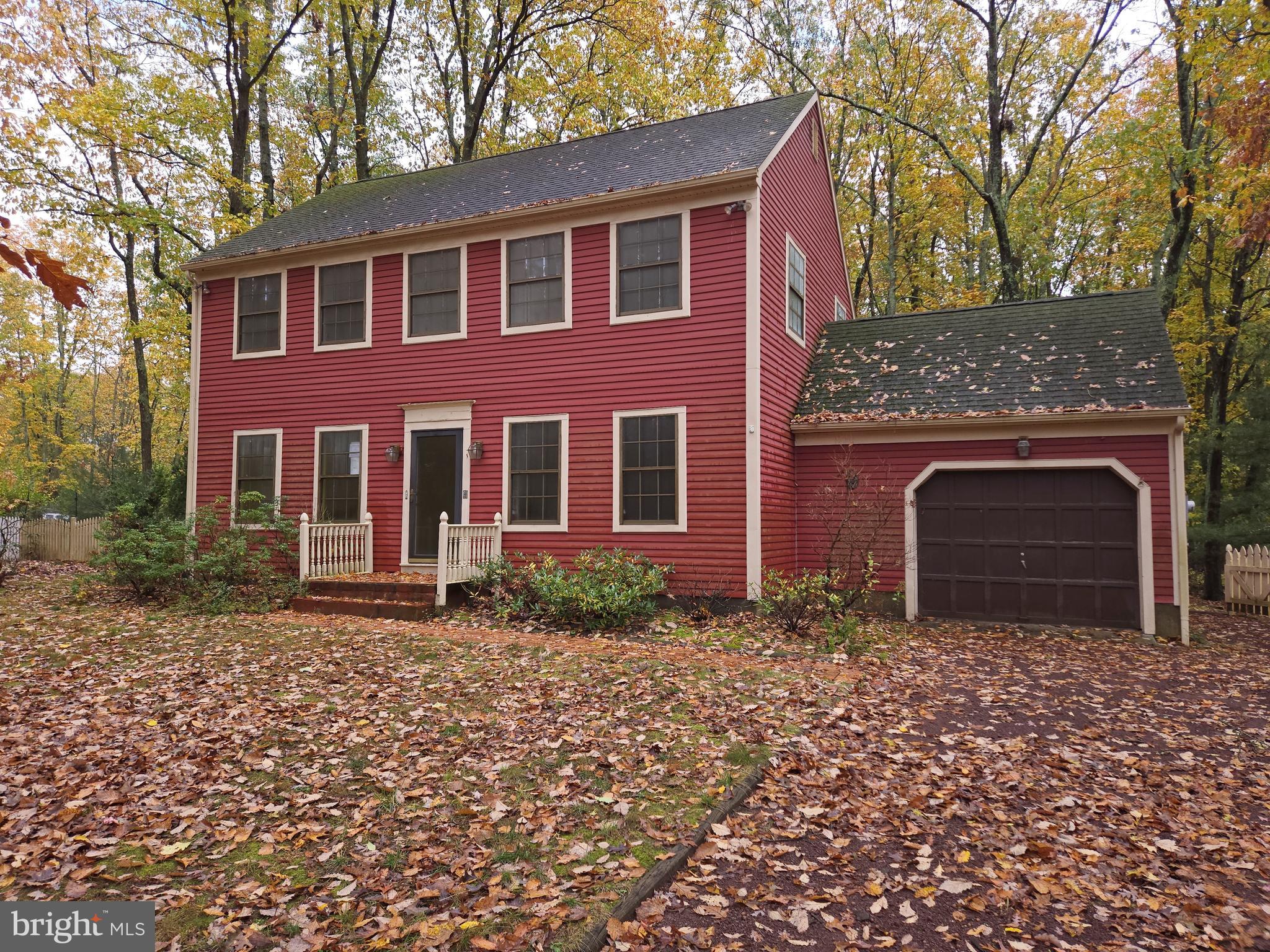 a front view of a house with yard