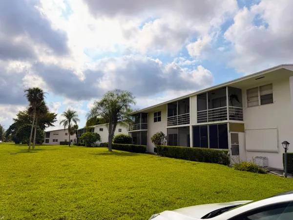 a view of house with yard