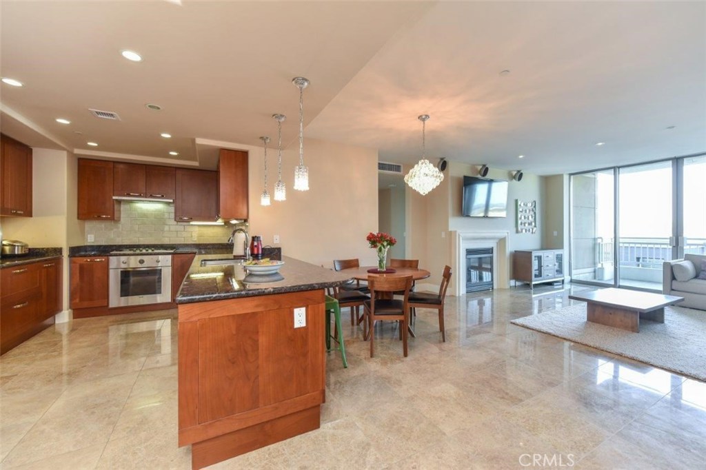 a large kitchen with lots of counter space and furniture