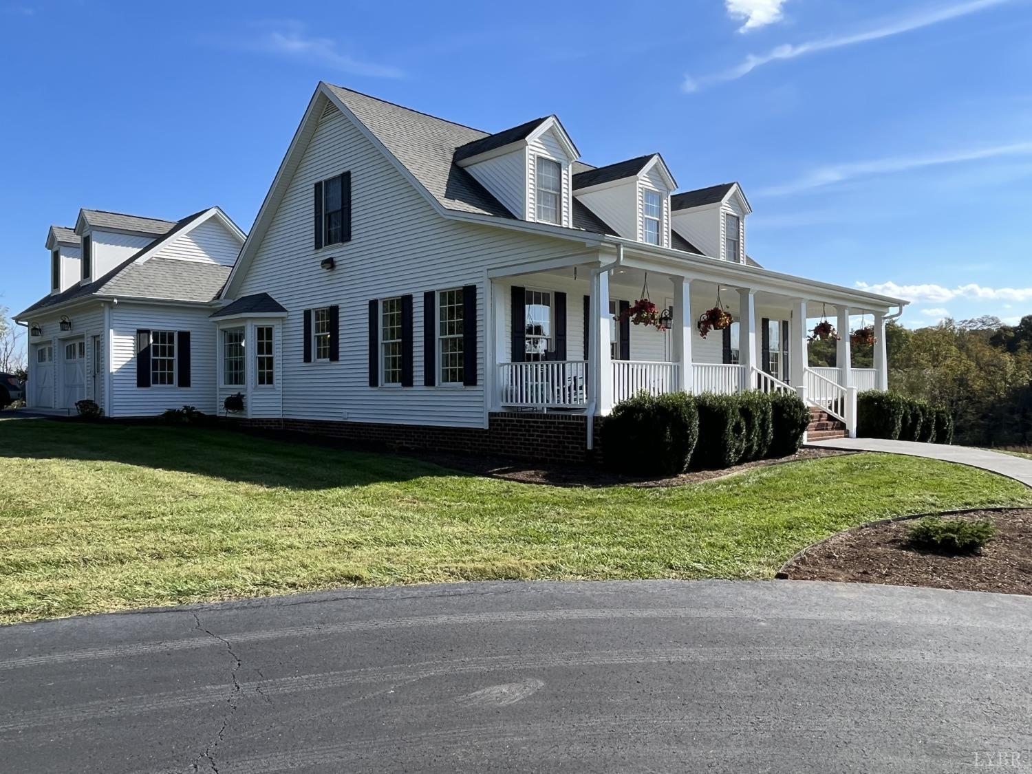 1959 Founding Way Road Goode, VA 24556 - Photo 1 of 65 a front view of a house with a yard and potted plants