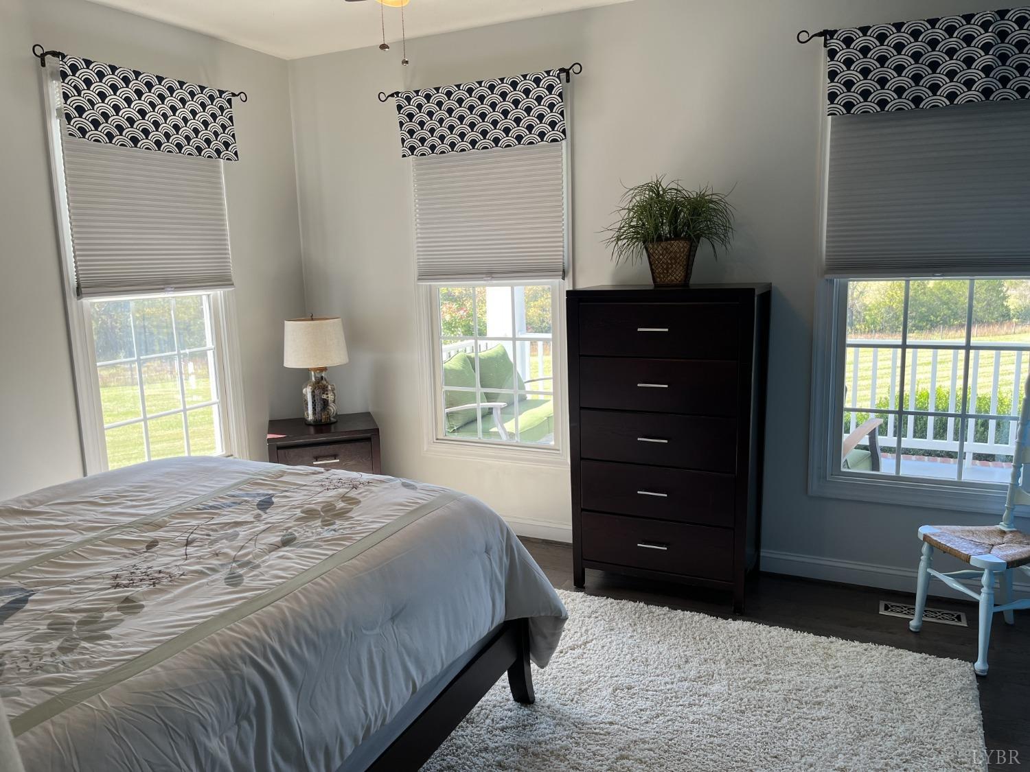 1959 Founding Way Road Goode, VA 24556 - Photo 23 of 65 a bedroom with a bed and a dresser