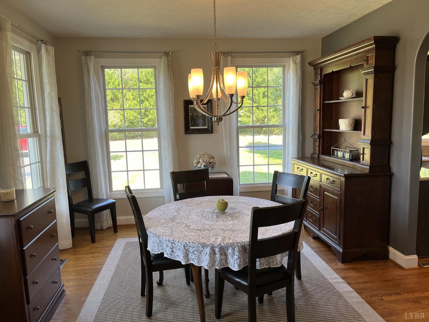 1959 Founding Way Road Goode, VA 24556 - Photo 5 of 65 a view of a dining room with furniture window and outside view
