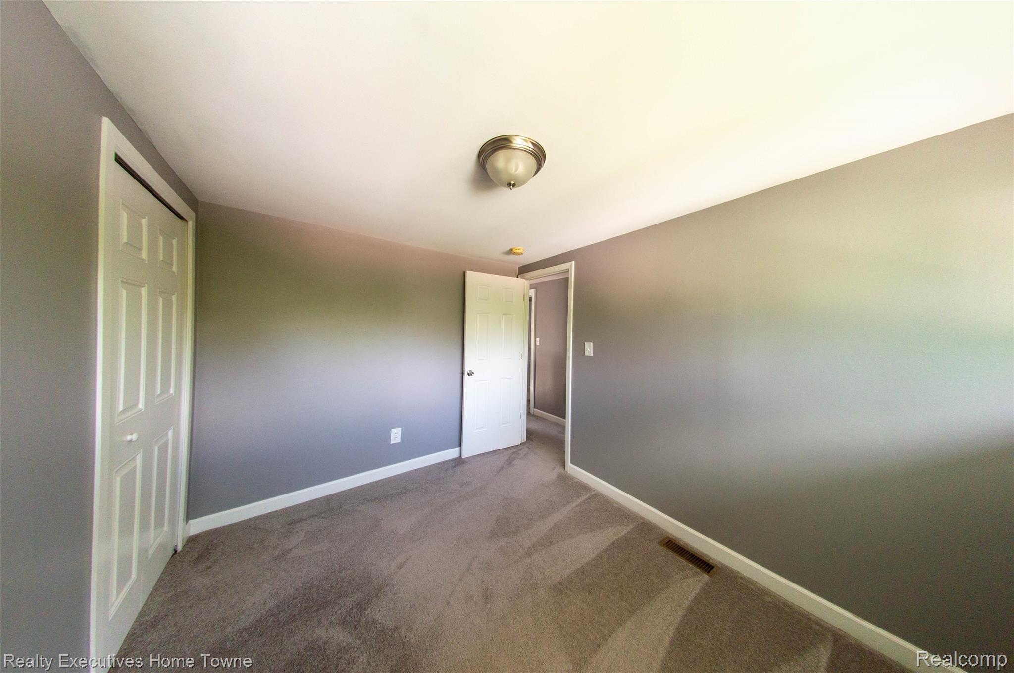 2676 Cumberland Road Berkley, MI 48072 - Photo 23 of 38 Room featuring gray wall paint, white trim, and light brown carpeting