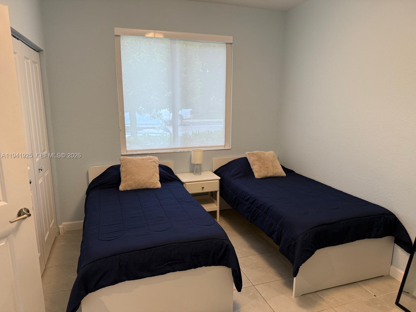 887 Northeast 211th Street Miami, FL 33179 - Photo 14 of 25 a living room with furniture