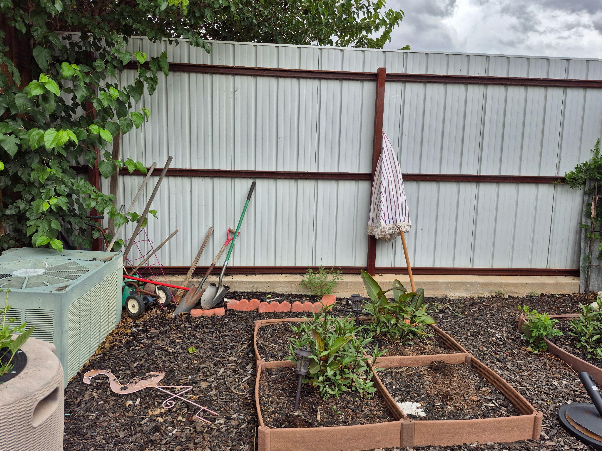 735 South 12th Street Slaton, TX 79364 - Photo 14 of 16 a garden view with a seating space
