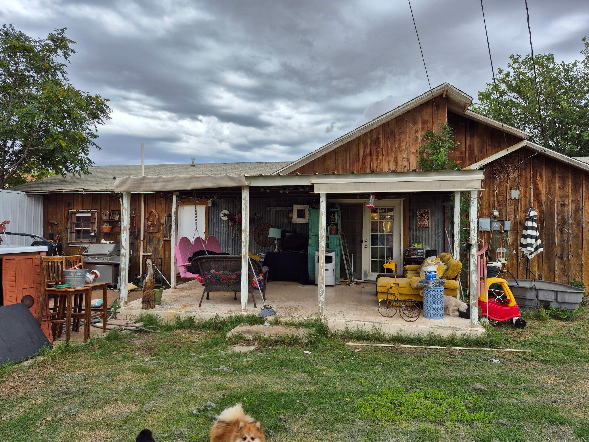 735 South 12th Street Slaton, TX 79364 - Photo 16 of 16 a view of a house with a yard patio and furniture