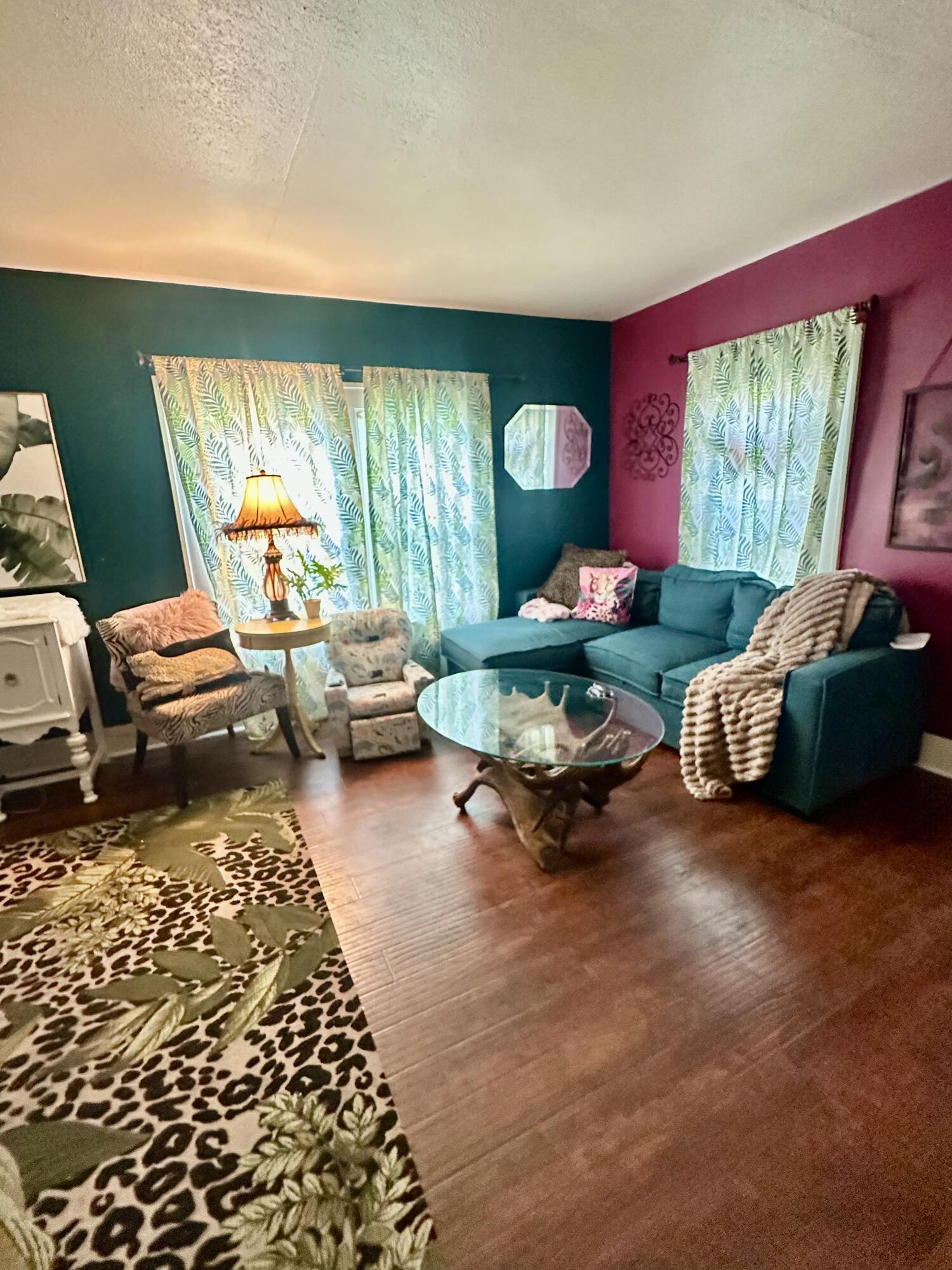 735 South 12th Street Slaton, TX 79364 - Photo 2 of 16 a living room with furniture and a large window