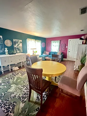 a view of a dining room with furniture
