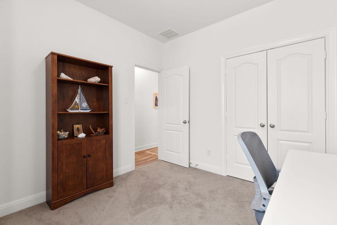 237 Benmyrtle Trail Georgetown, TX 78626 - Photo 13 of 22 Home office featuring light carpet and baseboards