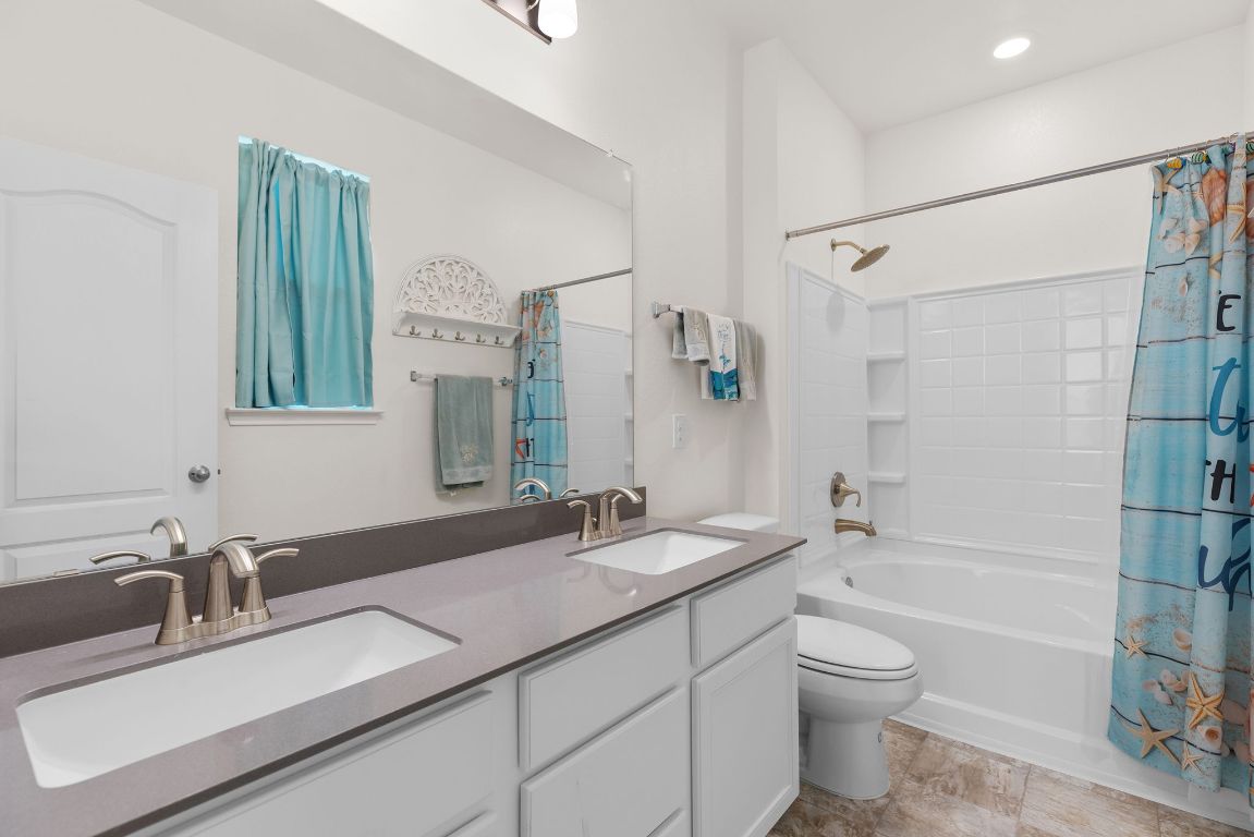 237 Benmyrtle Trail Georgetown, TX 78626 - Photo 18 of 22 Bathroom featuring shower / bath combo and double vanity