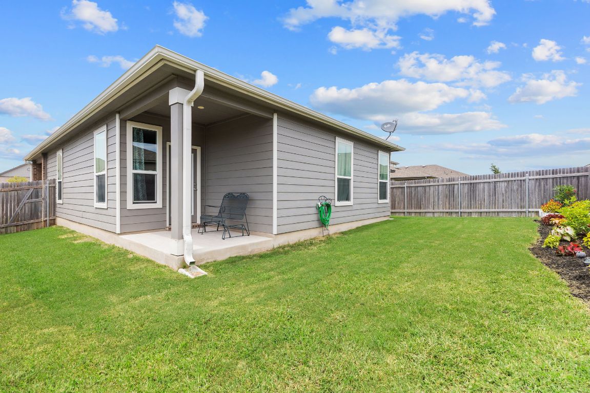 237 Benmyrtle Trail Georgetown, TX 78626 - Photo 20 of 22 Rear view of house featuring a fenced backyard and a patio area