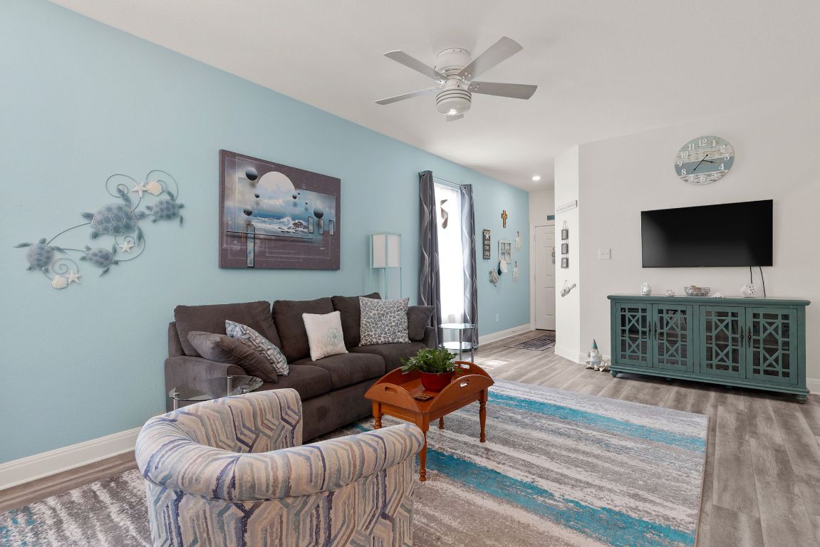 237 Benmyrtle Trail Georgetown, TX 78626 - Photo 3 of 22 Living area featuring wood finished floors and a ceiling fan
