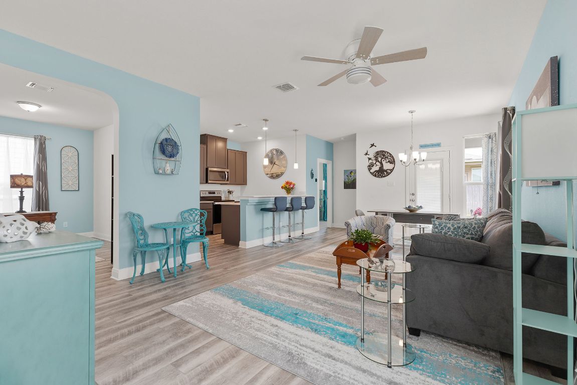 237 Benmyrtle Trail Georgetown, TX 78626 - Photo 6 of 22 Living area featuring a ceiling fan, light wood-style flooring, a chandelier, and recessed lighting