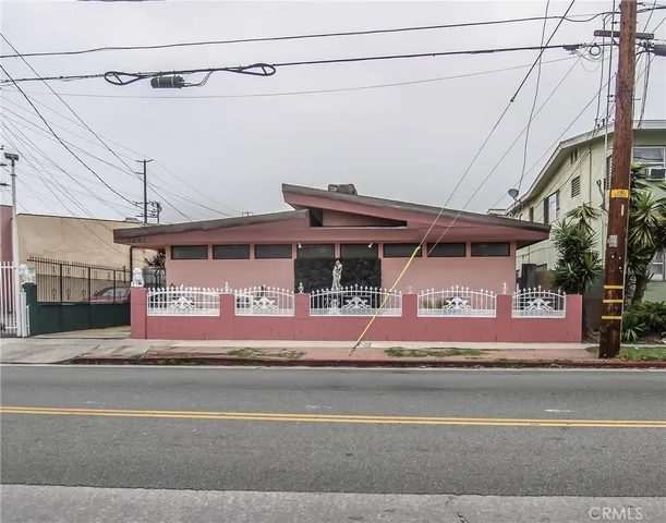 a view of a building with a sign on the wall