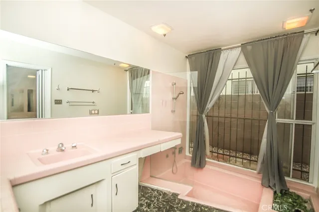 a view of empty room with a fireplace