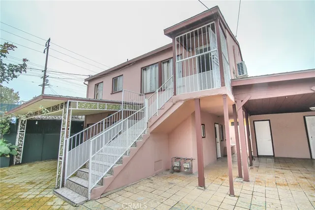 a bedroom with a bed and a flat tv screen