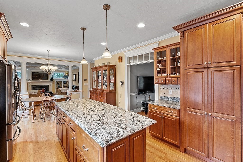 64 Walnut Street Rutland, MA 01543 - Photo 11 of 40 a kitchen with stainless steel appliances granite countertop counter space and wooden floors