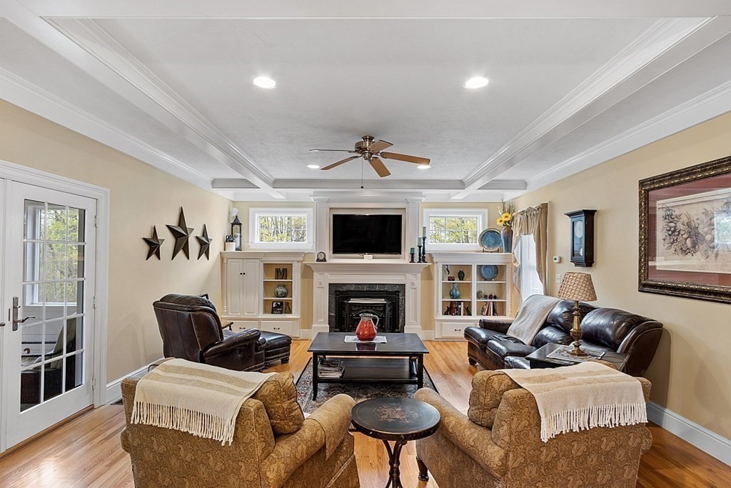 64 Walnut Street Rutland, MA 01543 - Photo 17 of 40 a living room with furniture a fireplace and a flat screen tv