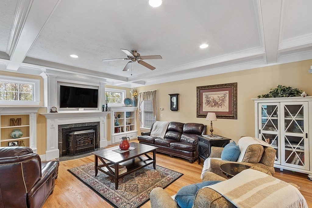 64 Walnut Street Rutland, MA 01543 - Photo 18 of 40 a living room with furniture fireplace and a flat screen tv