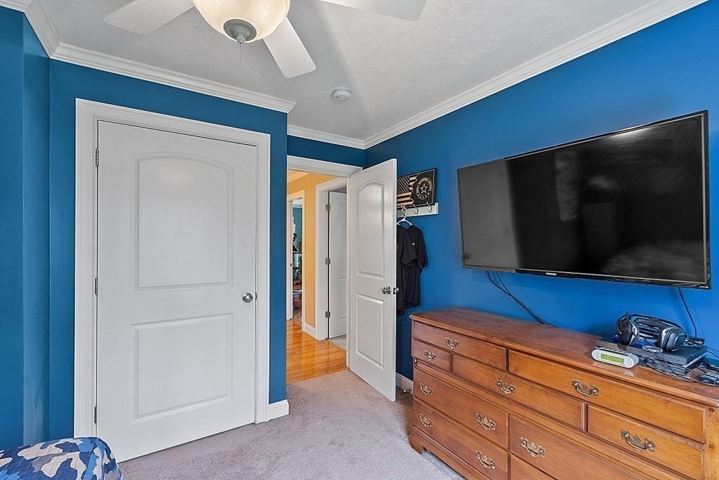 64 Walnut Street Rutland, MA 01543 - Photo 25 of 40 a living room with closet and a flat screen tv