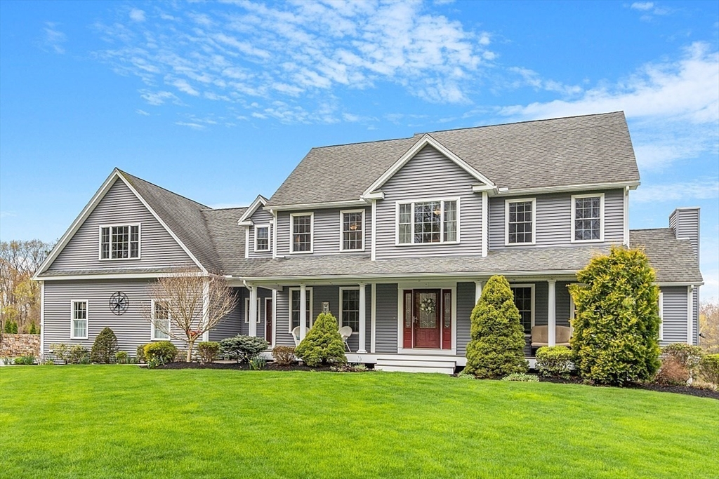 64 Walnut Street Rutland, MA 01543 - Photo 3 of 40 a front view of a house with a garden