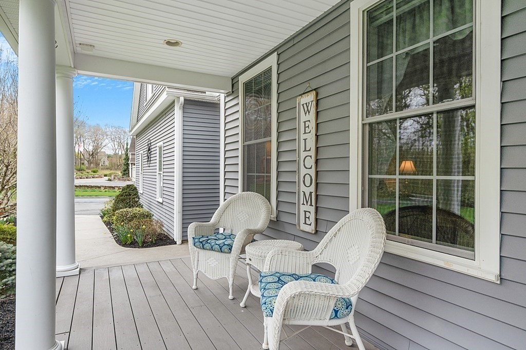 64 Walnut Street Rutland, MA 01543 - Photo 4 of 40 a view of balcony with two chairs and a potted plant