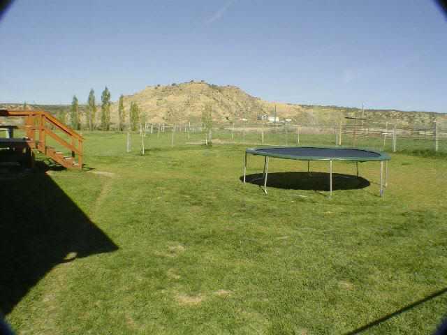 810 223rd Road Rifle, CO 81650 - Photo 3 of 9 a view of a large building with an outdoor space