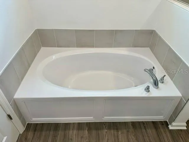 a close up of a bathtub in a bathroom