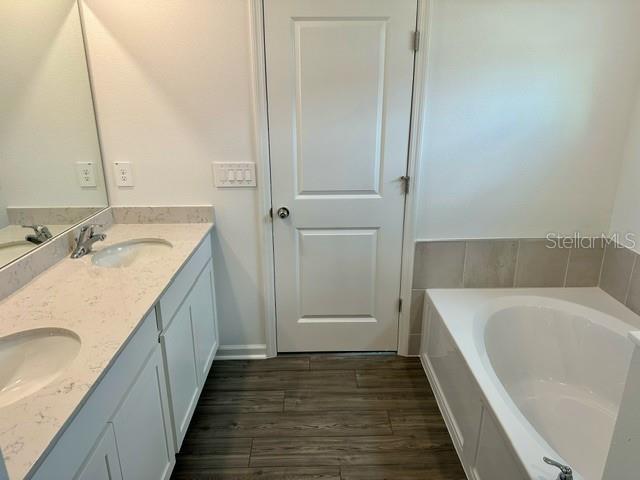 4734 Southwest 83rd Loop Ocala, FL 34476 - Photo 14 of 28 a bathroom with a tub sink and mirror