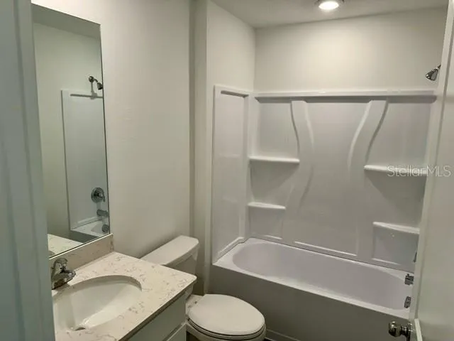 a bathroom with a sink toilet and bathtub