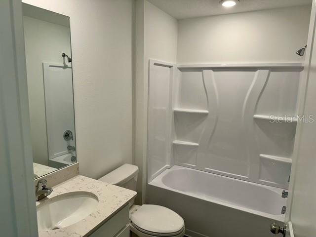 4734 Southwest 83rd Loop Ocala, FL 34476 - Photo 22 of 28 a bathroom with a sink toilet and bathtub