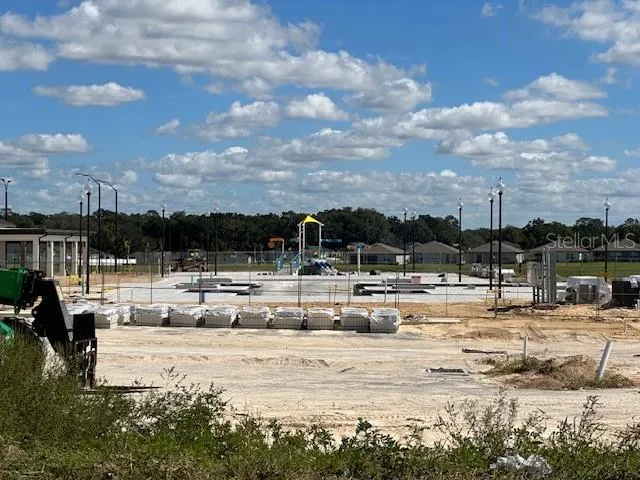 a view of pool with ocean view