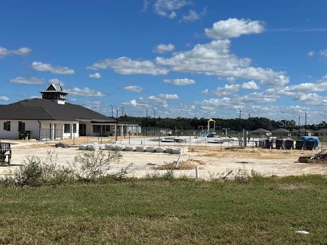 4734 Southwest 83rd Loop Ocala, FL 34476 - Photo 28 of 28 a view of a house with a yard