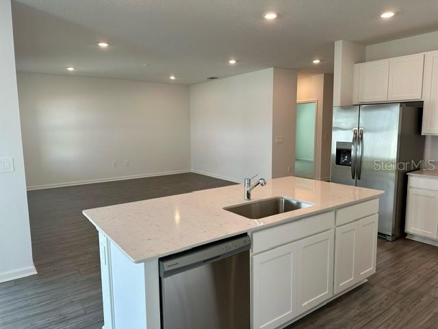 4734 Southwest 83rd Loop Ocala, FL 34476 - Photo 4 of 28 a kitchen with a sink and cabinets