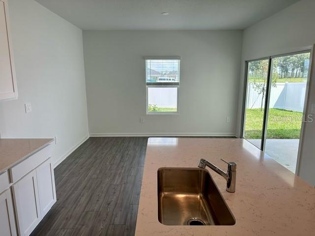 4734 Southwest 83rd Loop Ocala, FL 34476 - Photo 5 of 28 a room with window and wooden floor