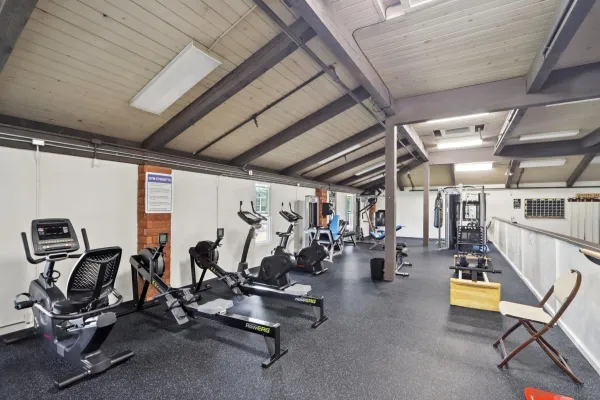 a living room with a large window and furniture